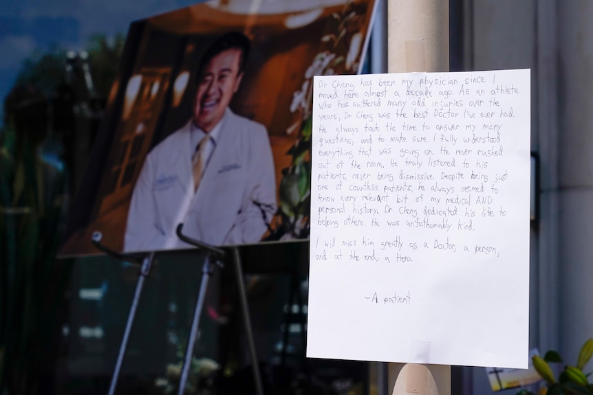 A note from a patient is left at a memorial honoring a victim of gun violence