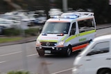 Tasmanian ambulance in motion.