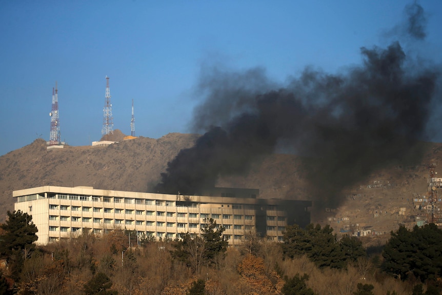 Smoke rises from the Intercontinental Hotel during an attack.