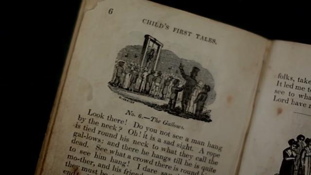 An old book opened with text re "Child's first tales"