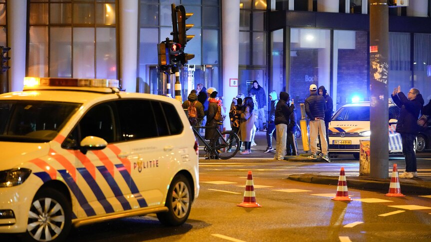 Police vehicles cordon off a wide area in Amsterdam