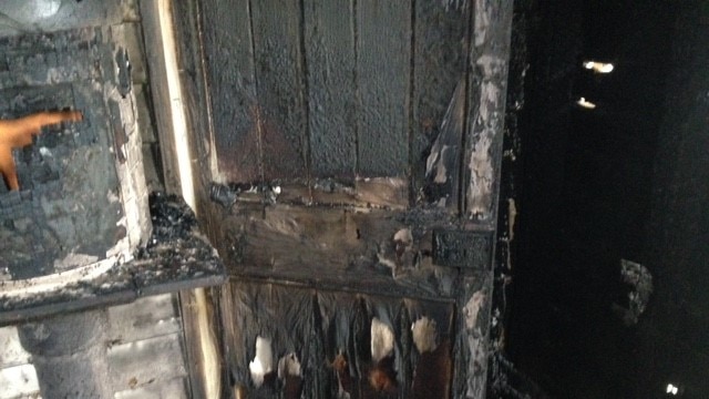 Burnt door in church.