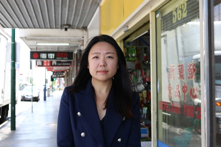 Tina Liu stands on a street in Box Hill.