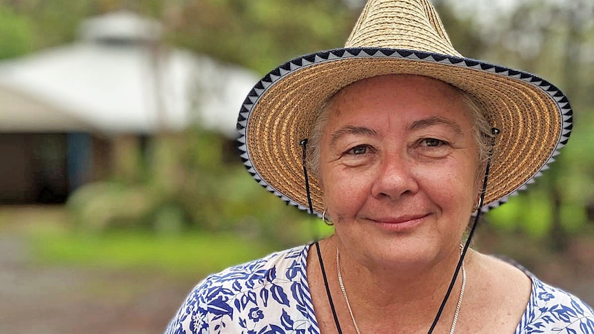 Daintry Garrand wears a sun hat and a white and blue top.