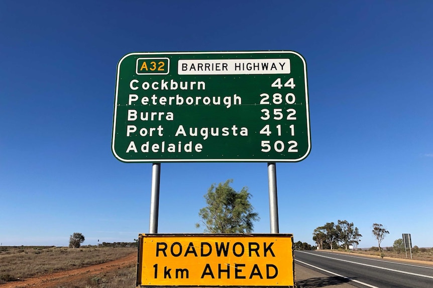 A sign on the Barrier Highway at Broken Hill listing distances to towns towards Adelaide.