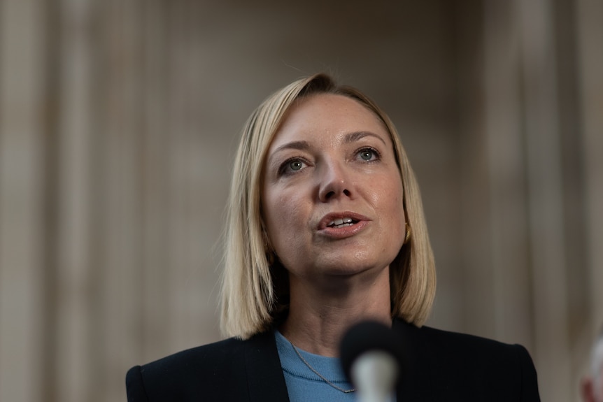 Mia Davies looks upwards while speaking