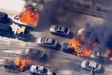 Wildfire overruns packed freeway in California
