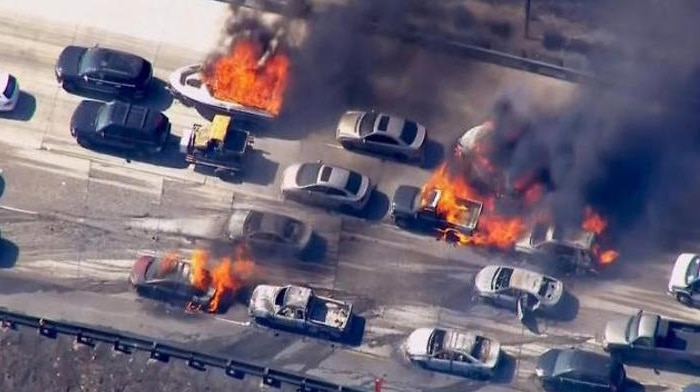 Wildfire overruns packed freeway in California