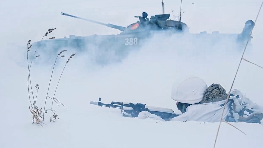 A Russian tank is scene in the snow.