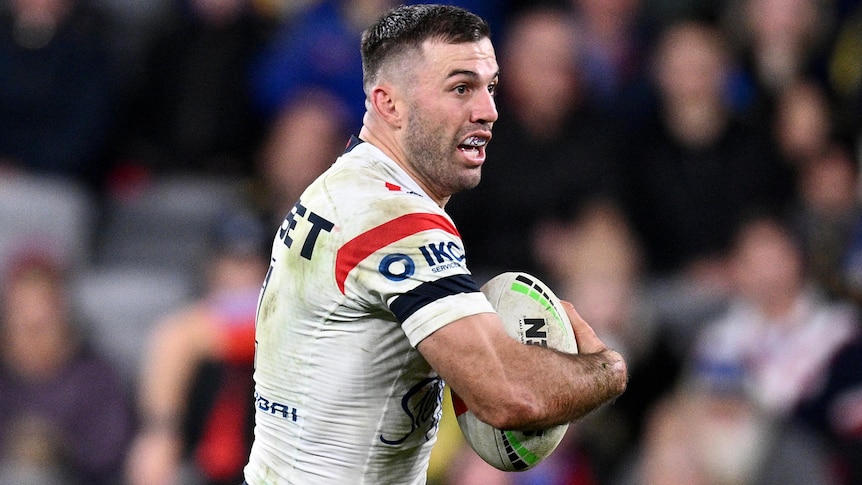 James Tedesco runs the ball for the Roosters against the Eels.