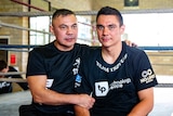 Two men pose during a boxing training session