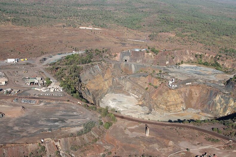 an aerial shot of a pit at a gold mine