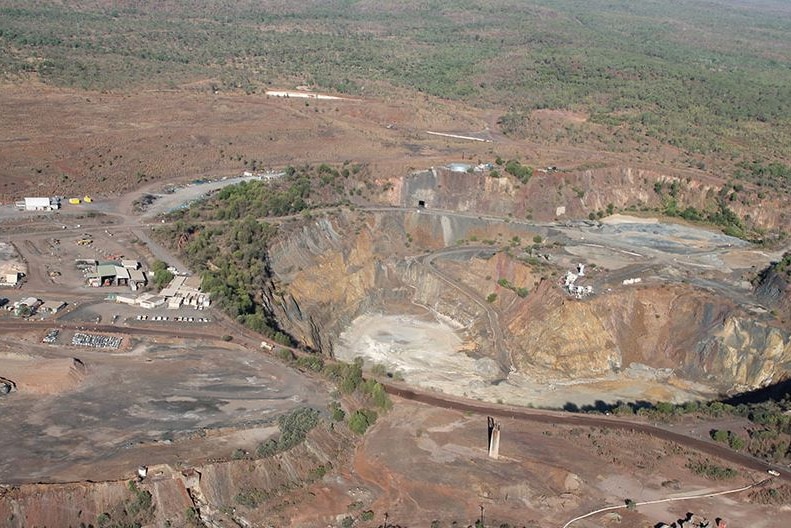 an aerial shot of a pit at a gold mine