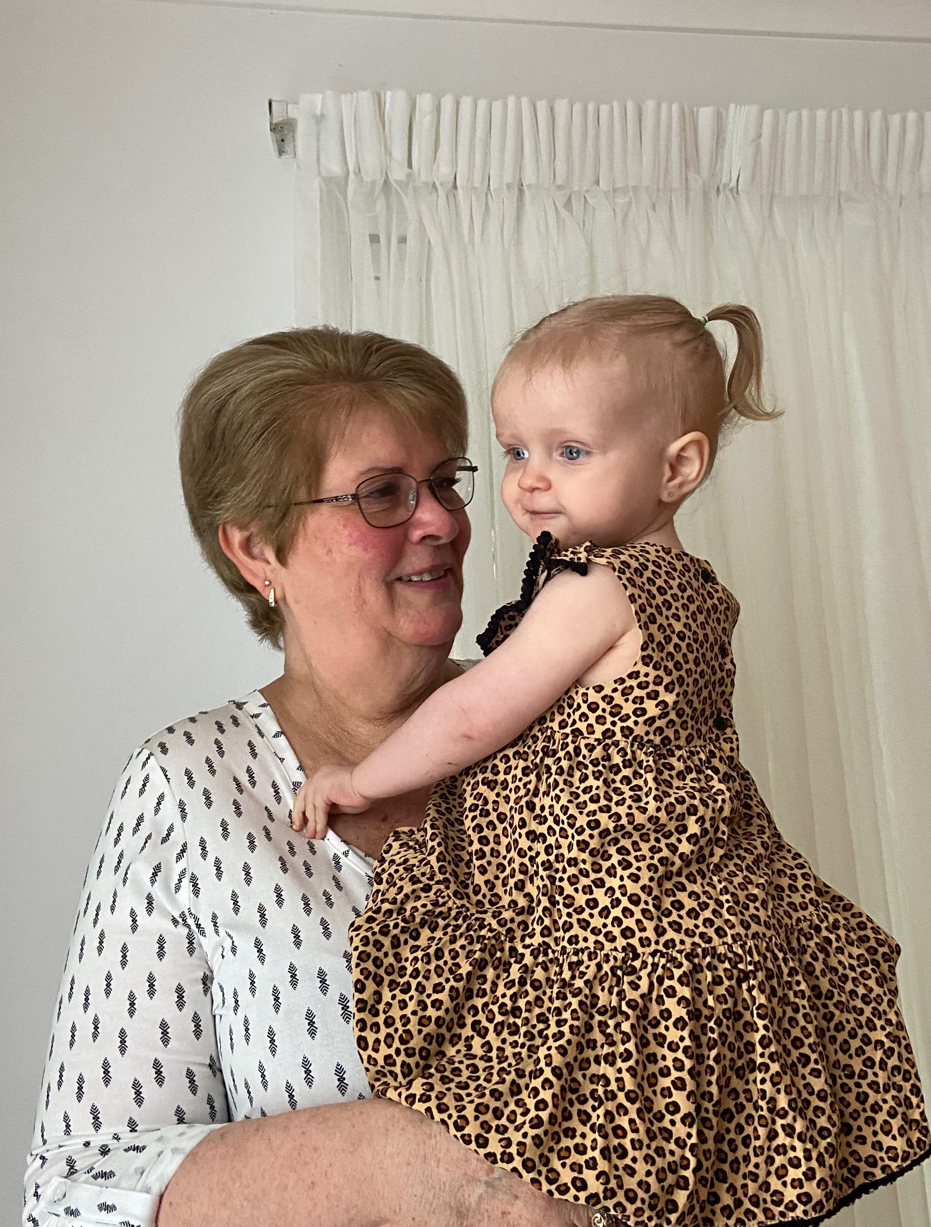 Rosemarie Campbell holding a younger child. 