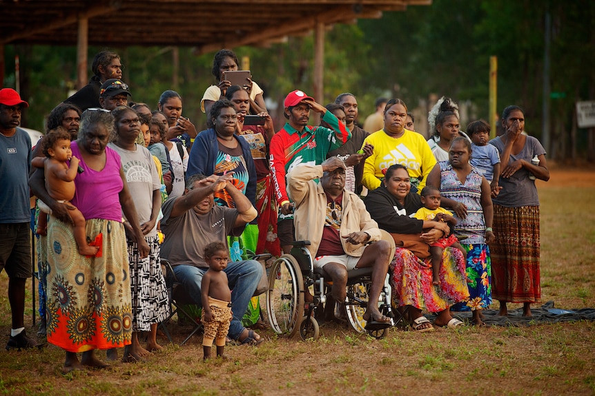 A group of people watching performers