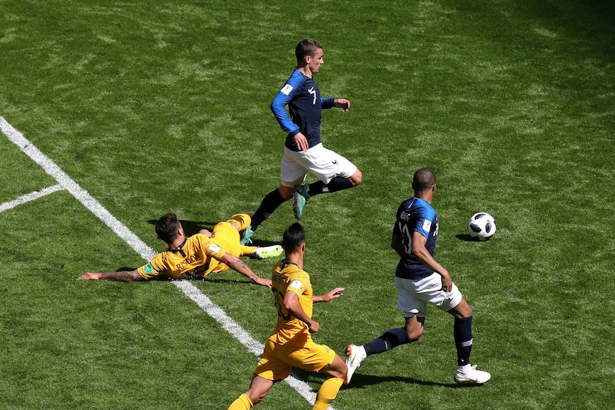 Josh Risdon slides in on Antoine Griezmann