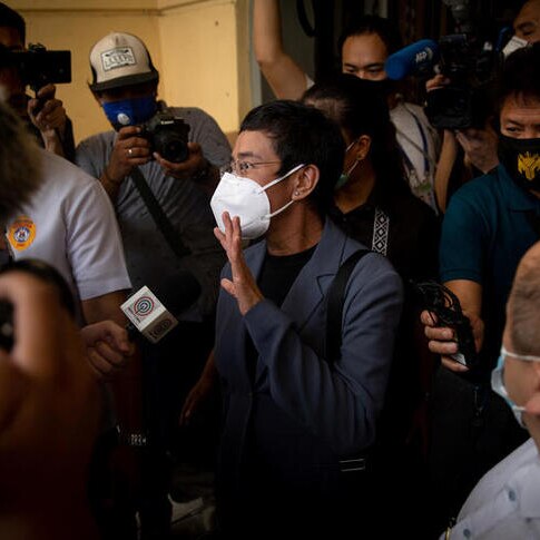 Maria Ressa walks out of Manila City Hall surrounded by media after being found guilty of cyber libel.