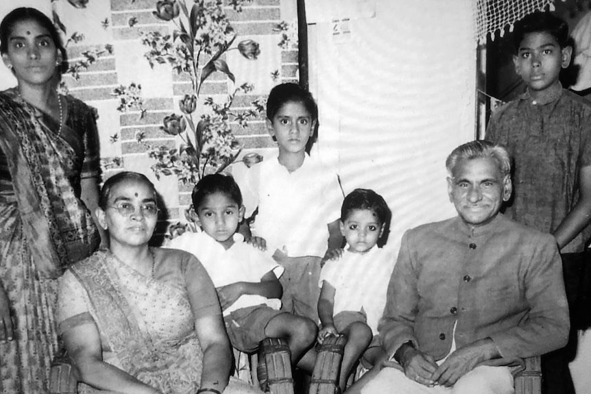A Gujarati family poses in their living room.