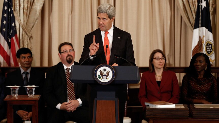 John Kerry + trafficking report.jpg
