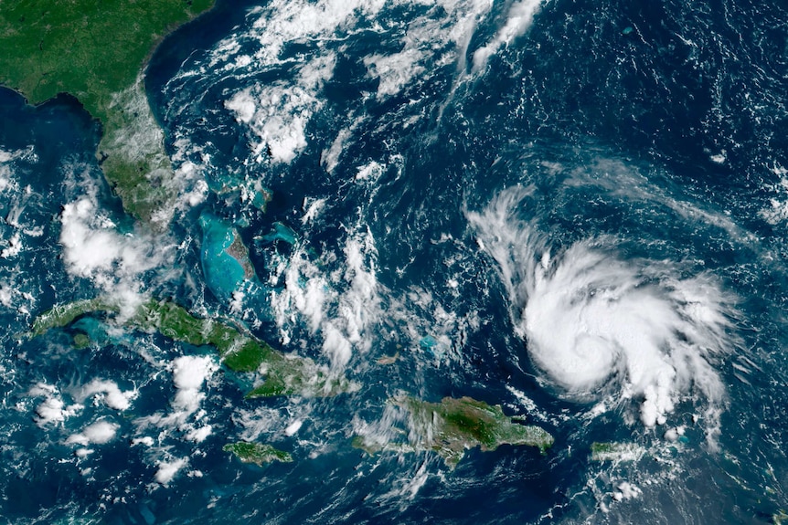 A satelite image shows Hurricane Dorian spiralling through Caribbean waters in a westerly direction towards Florida