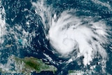 A satelite image shows Hurricane Dorian spiralling through Caribbean waters in a westerly direction towards Florida