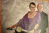 Kathleen and Kenny Watson sitting on a scooter