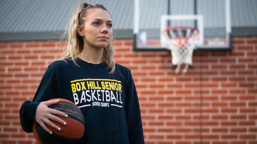 Zoe Jenkins holding basketball.