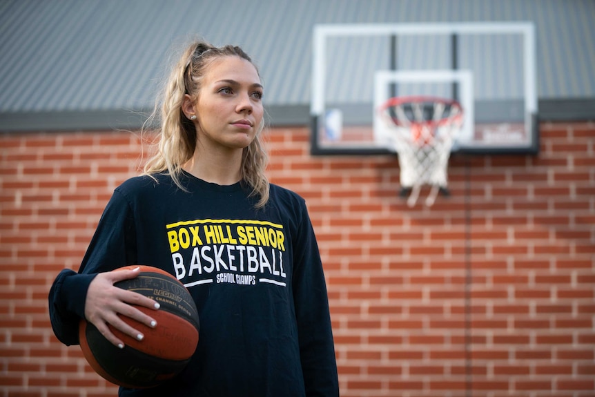 Zoe Jenkins holding basketball.