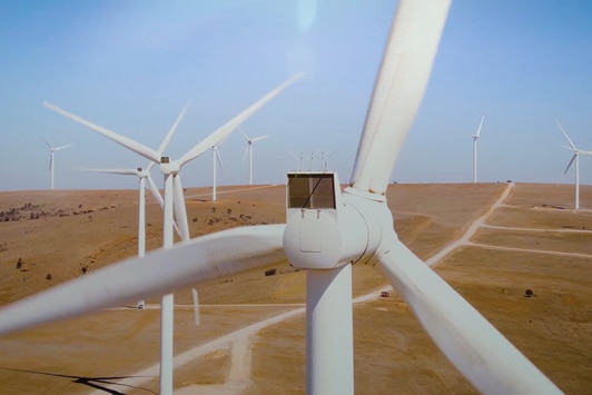 A wind farm in the Australian outback, with turbines dotting the landscape
