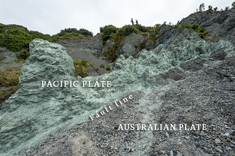 From the lower left to the top right of frame runs a visible seam of two kinds of rock. 