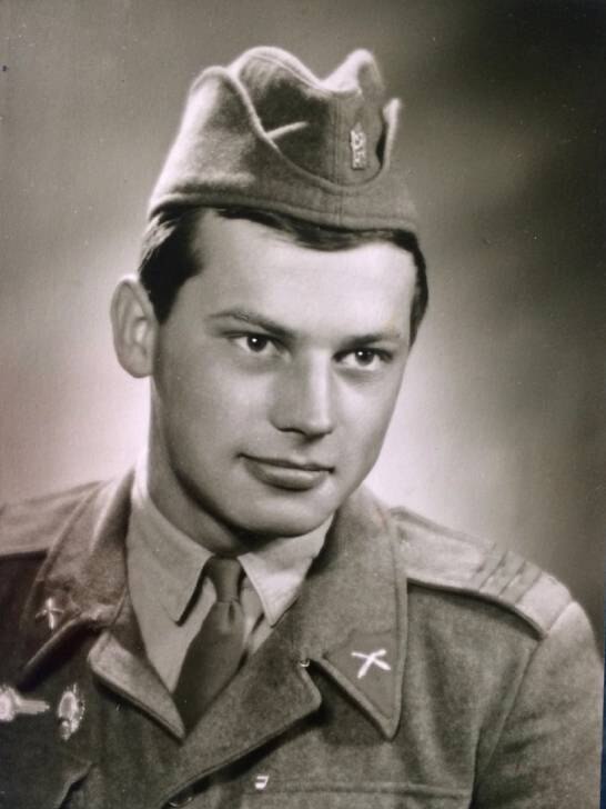A black and white portrait of a man in uniform.