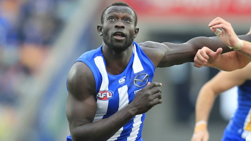 Majak Daw looking up during a game for North Melbourne