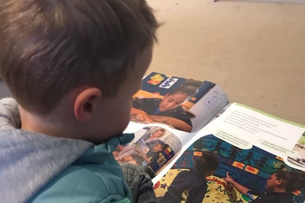 A boy reads a book