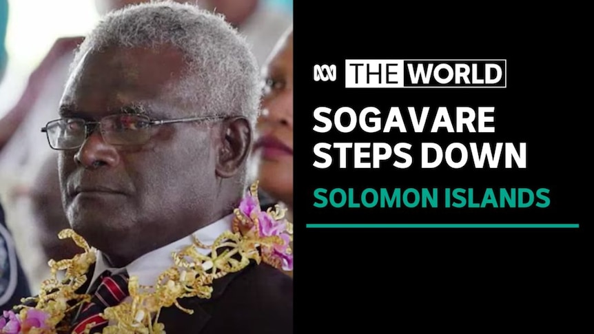Sogavare Steps Down, Solomon Islands: A man in a suit wearing a floral necklace.