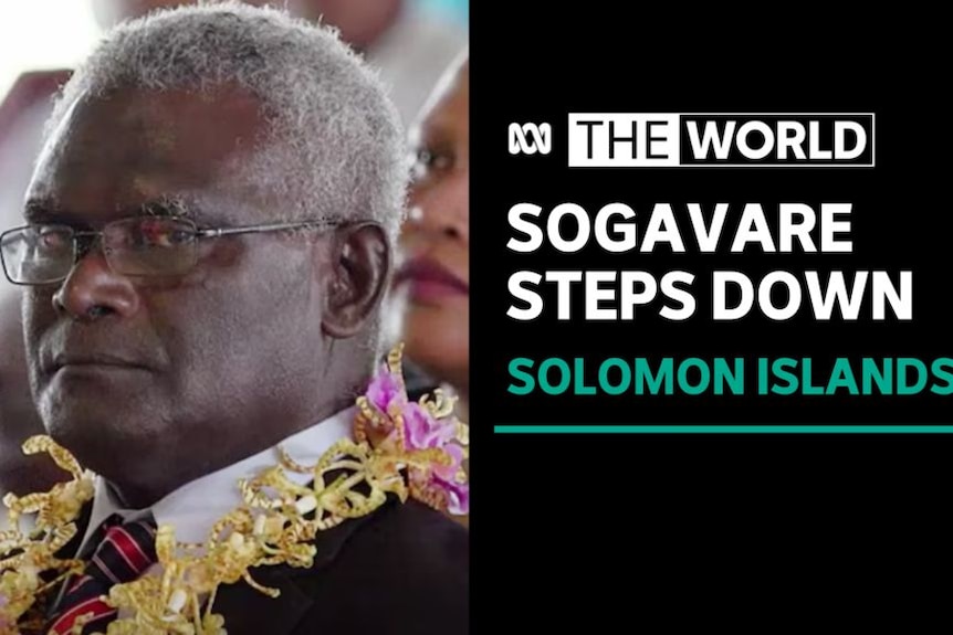 Sogavare Steps Down, Solomon Islands: A man in a suit wearing a floral necklace.