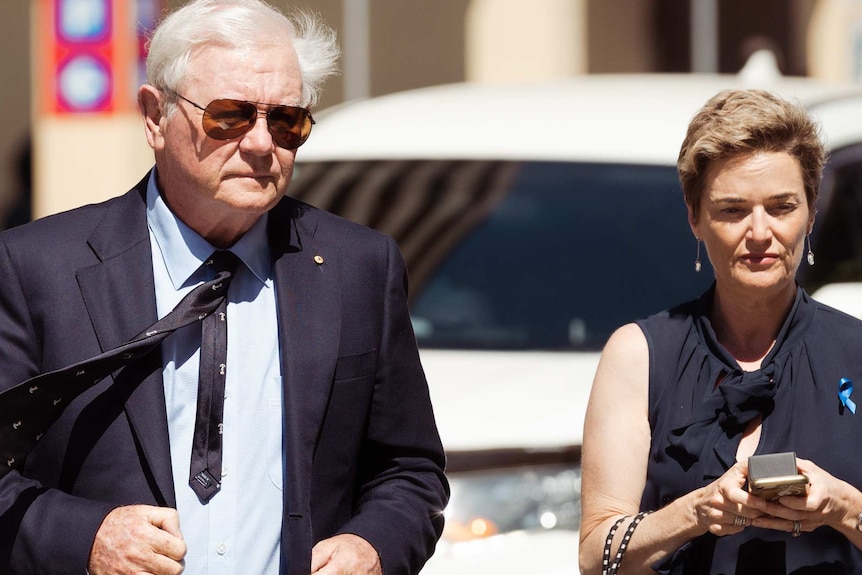 Denis and Denise Glennon on the street in front of the WA District Court.