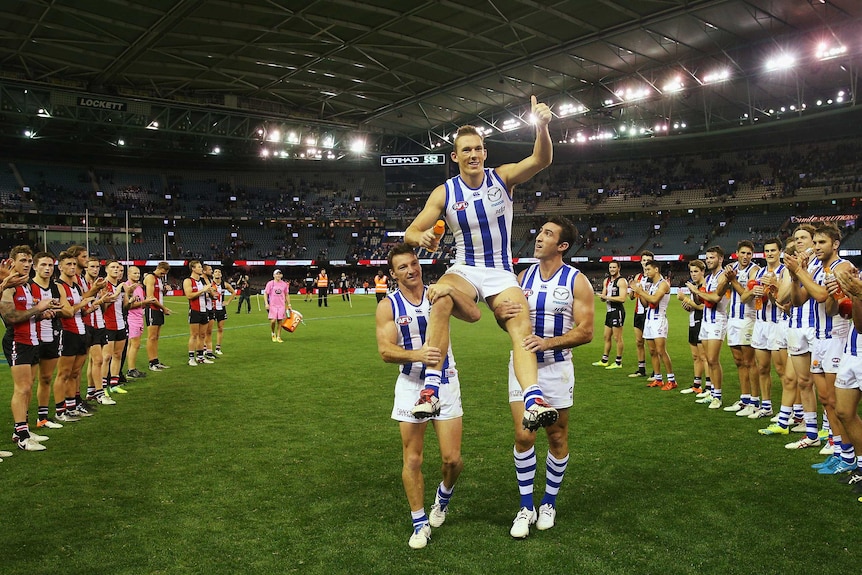 Drew Petrie is chaired off after his 300th game