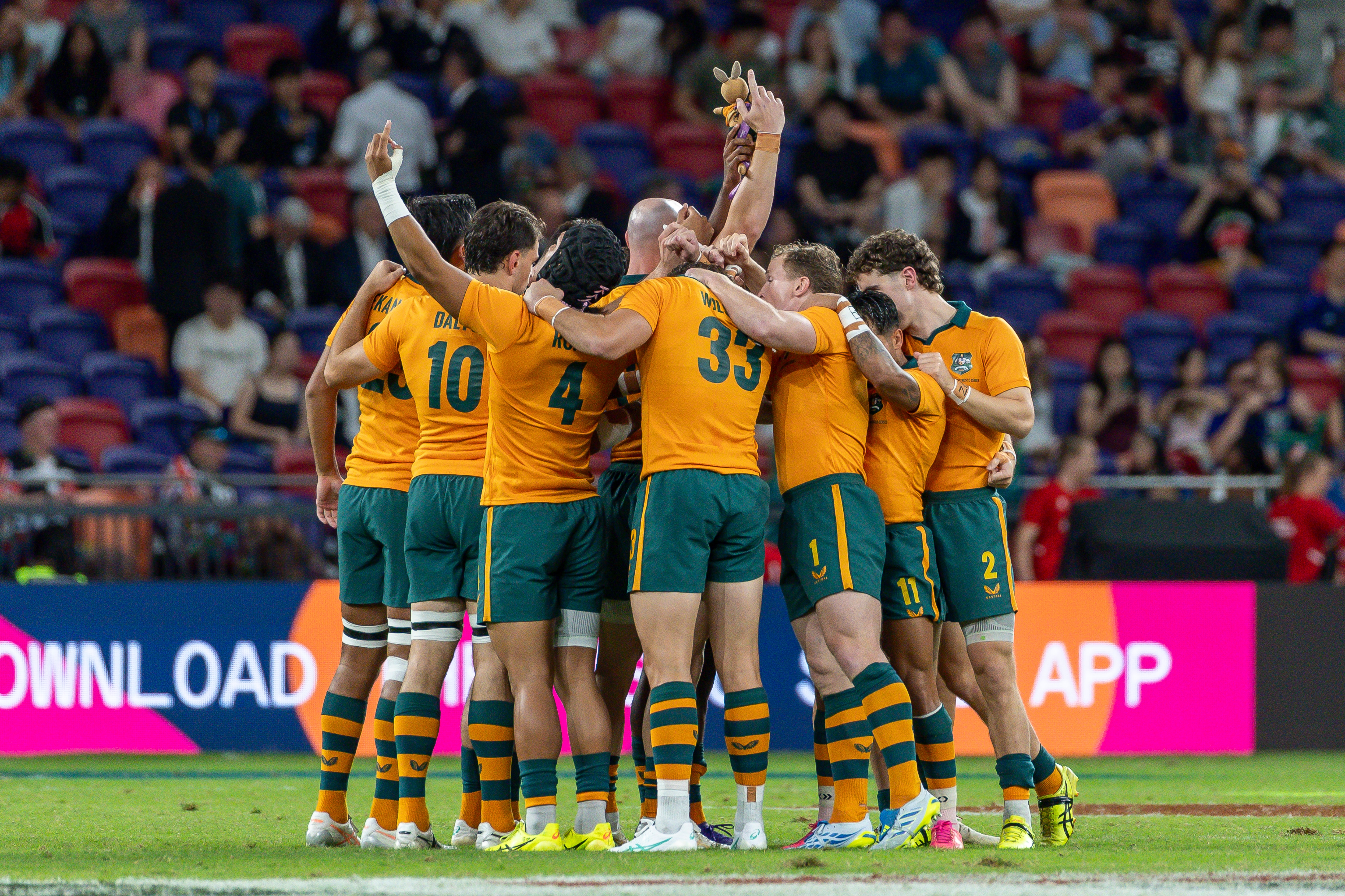 Australia in a huddle before a men's rugby sevens match in Hong Kong.