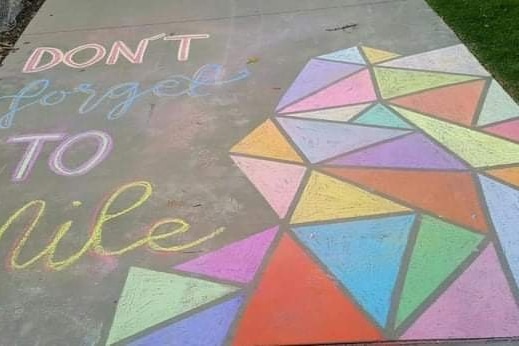 A colourful chalk picture that says 'Dont forget to smile'
