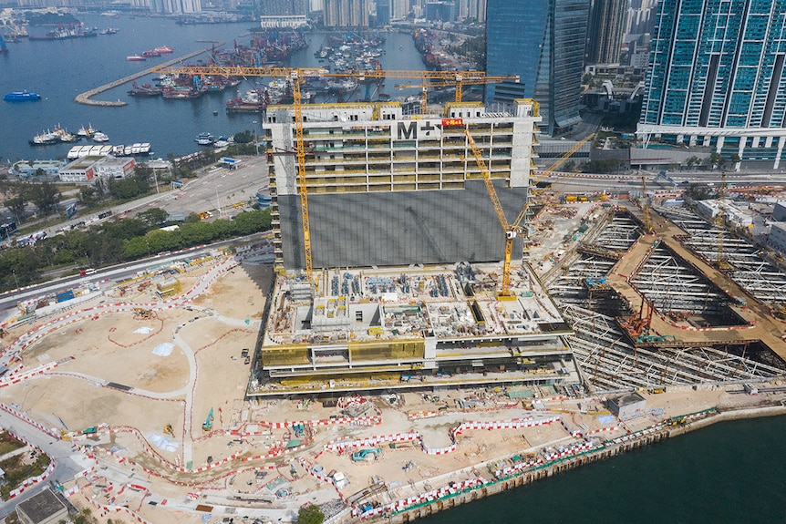 Colour photo of M+ under construction in the West Kowloon Cultural District of Hong Kong.