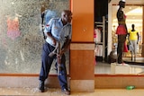 A police officer secures an area of the mall.