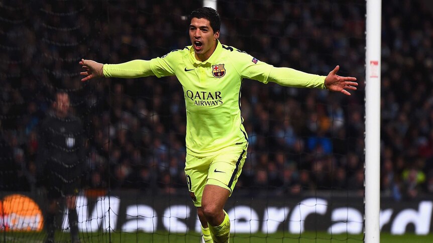 On target ... Luis Suarez celebrates scoring a goal for Barcelona