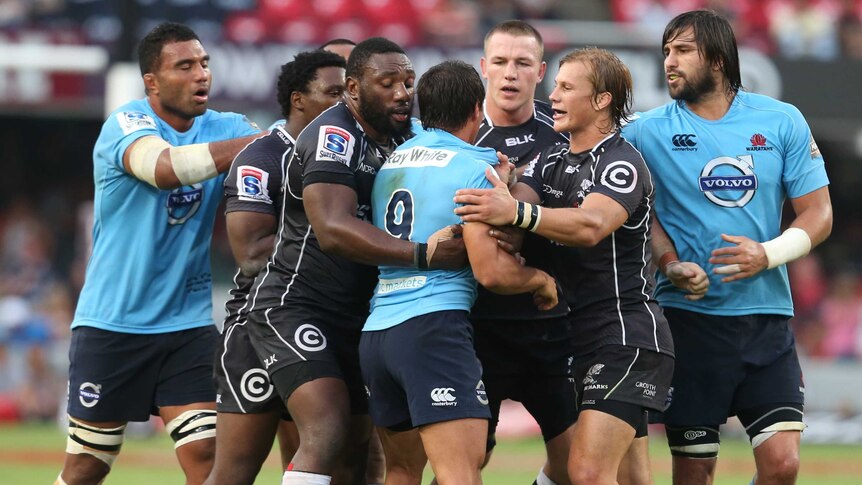Fiery encounter ... Nick Phipps gets involved in a scuffle with Sharks players
