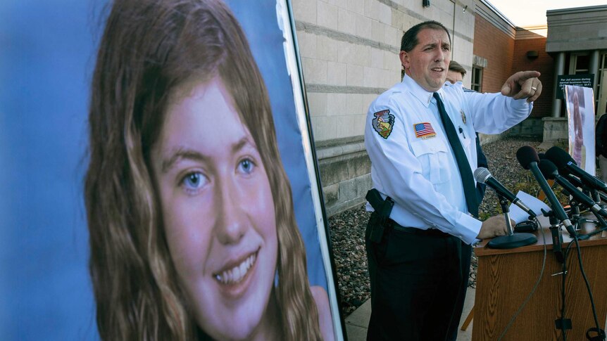 Sheriff Chris Fitzgerald speaks at a press conference next to a picture of Jayme Closs