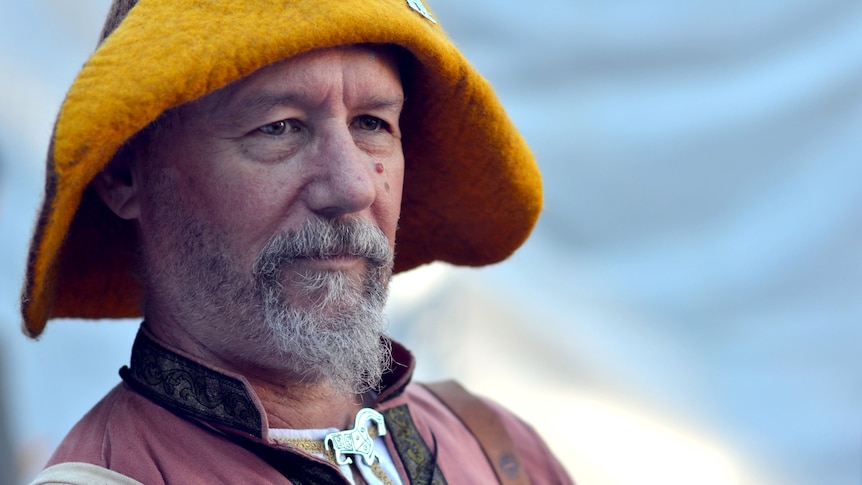 A man in medieval attire listens to a special broadcast of Australia All Over to mark 80 years of the ABC on July 1, 2012.