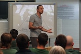Arman Abrahimzadeh speaking to a group of prisoners at the Mobilong Prison in South Australia.
