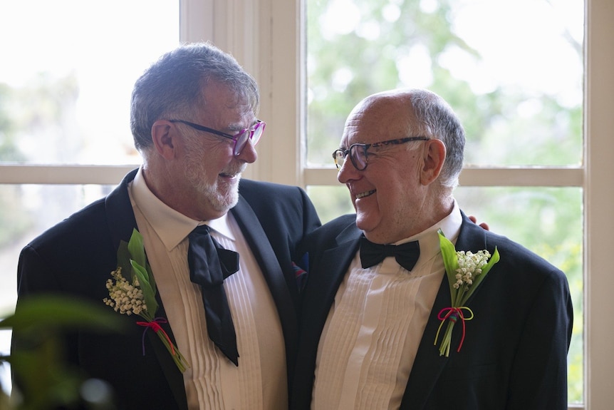 Two middle aged men on their wedding day