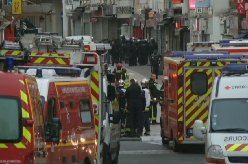 Daylight breaks during an anti-terrorism police raid in Saint Denis, Paris