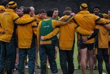 Australian rugby union players form a huddle during a training session in Sydney
