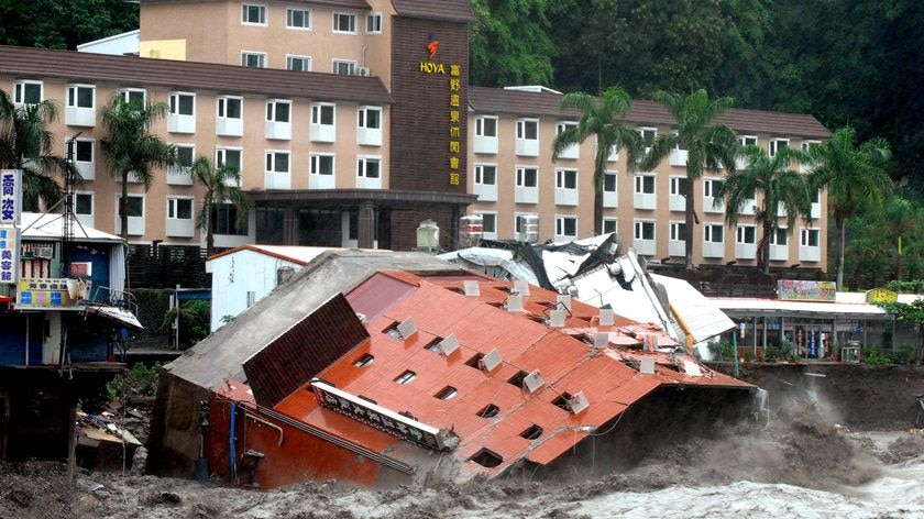 The Hotel Chin shuai lies in floodwater after collapsing during typhoon Morakot